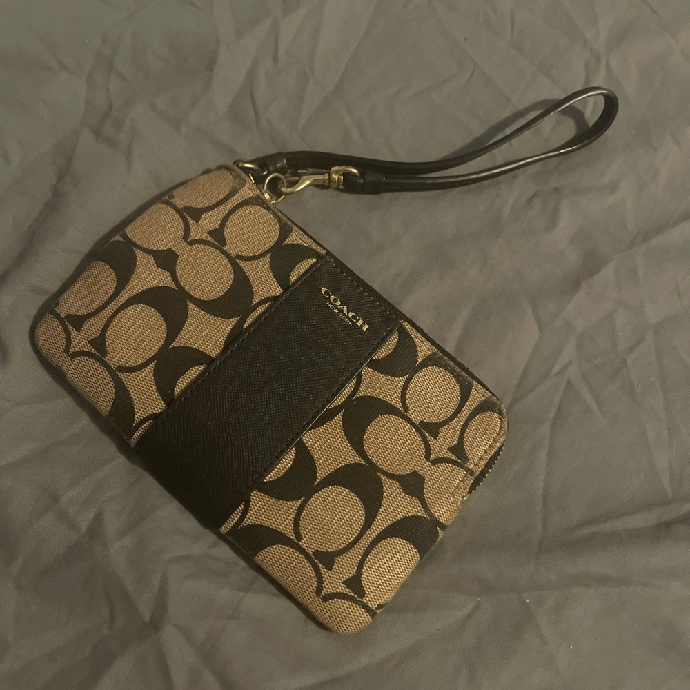 Small coach wristlet , Black and Tan, used but no stains.